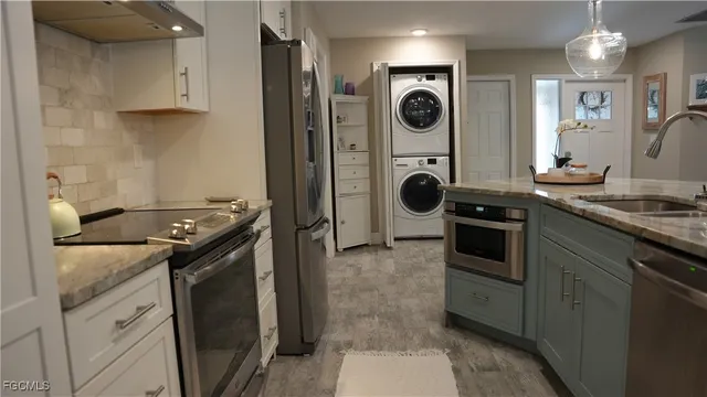 a kitchen with a stove and a refrigerator