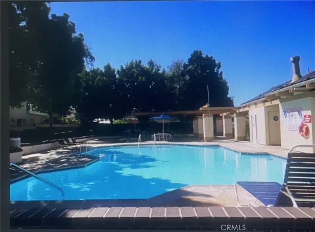 a view of a house with yard and sitting area