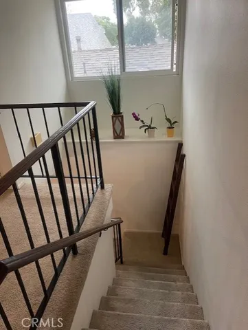 a view of a balcony with wooden floor