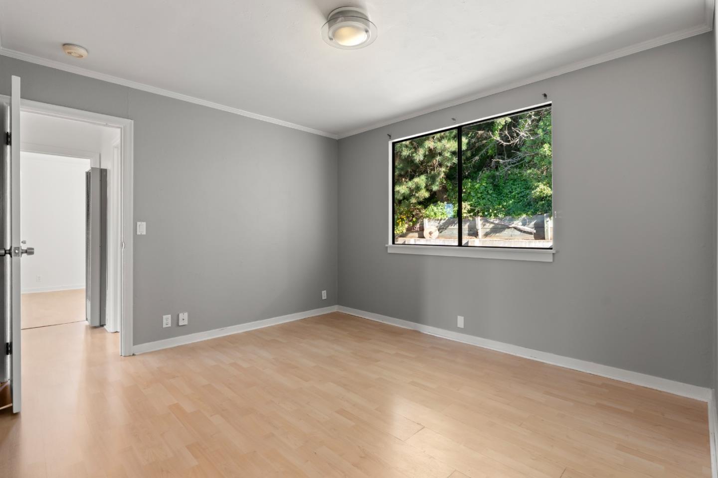 443 Monterey Road Pacifica, CA 94044 - Photo 12 of 26 a view of an empty room with window and closet area