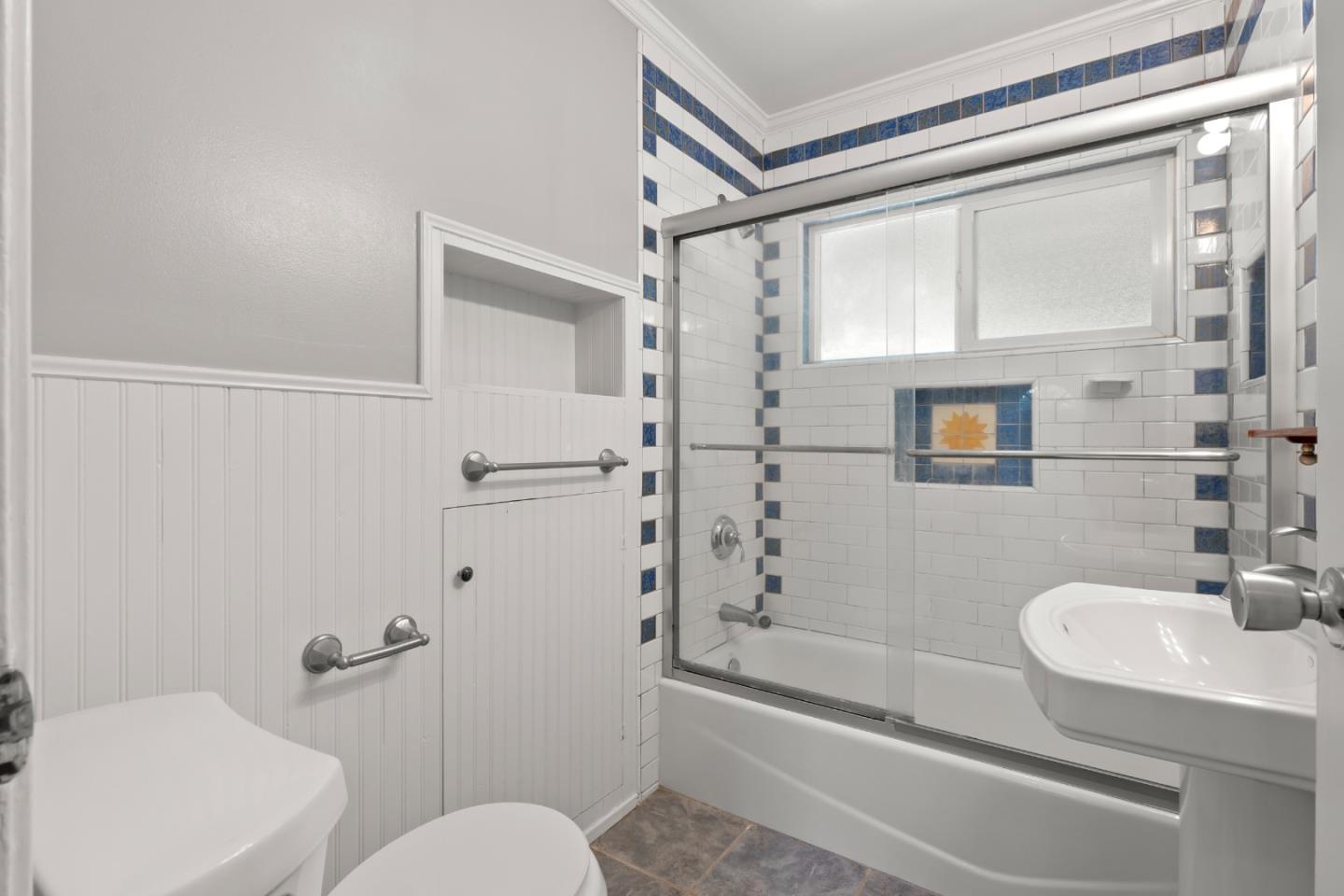 443 Monterey Road Pacifica, CA 94044 - Photo 14 of 26 a bathroom with a granite countertop sink toilet and shower