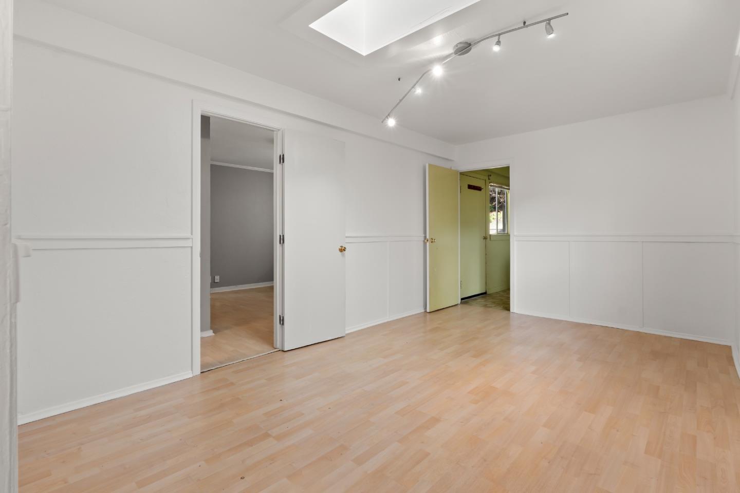 443 Monterey Road Pacifica, CA 94044 - Photo 16 of 26 an empty room with closet and a chandelier fan