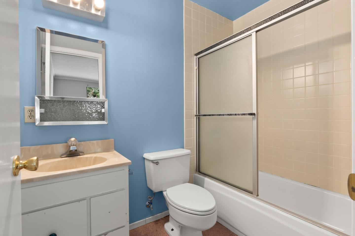 443 Monterey Road Pacifica, CA 94044 - Photo 19 of 26 a white toilet sitting next to a bathroom sink