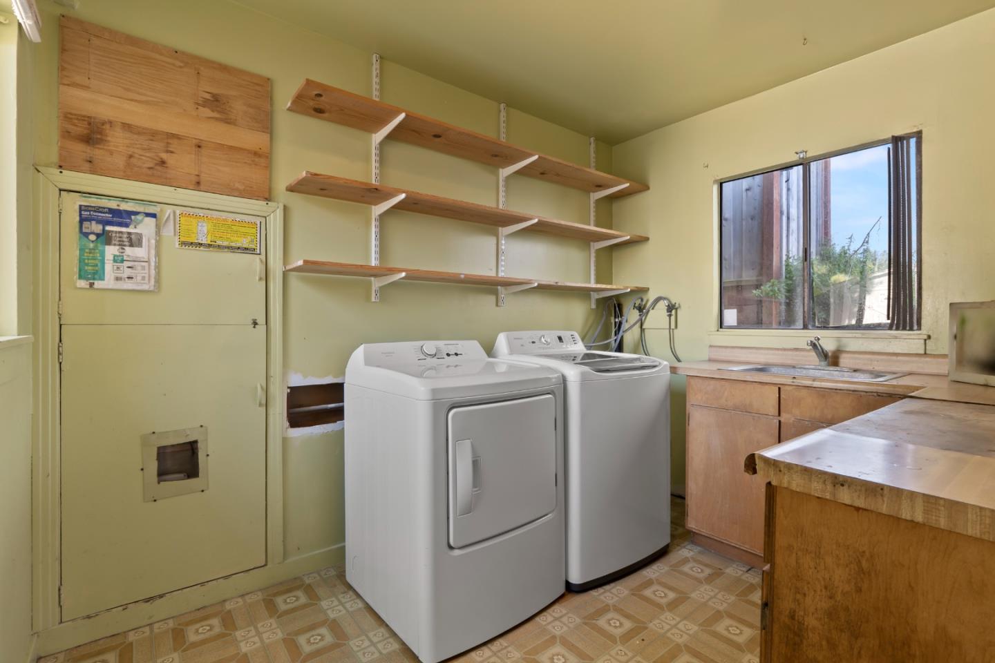 443 Monterey Road Pacifica, CA 94044 - Photo 20 of 26 a utility room with dryer and washer