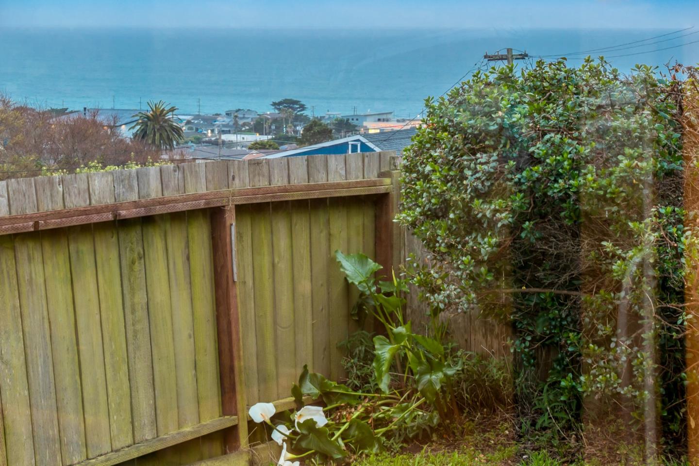 443 Monterey Road Pacifica, CA 94044 - Photo 2 of 26 a view of a backyard of the house