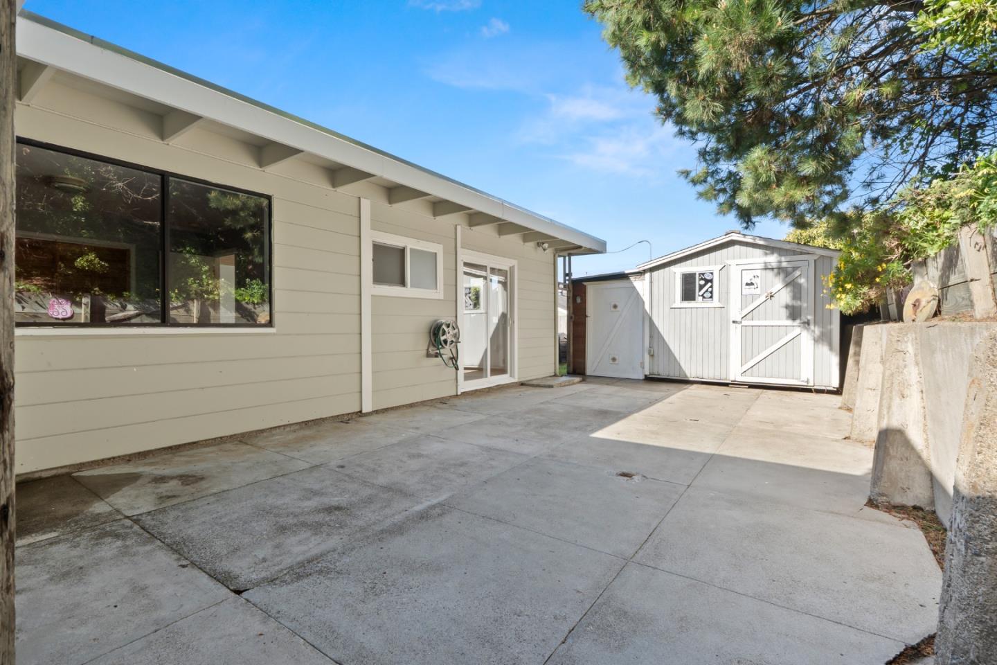 443 Monterey Road Pacifica, CA 94044 - Photo 21 of 26 a view of a house with a snow on the road
