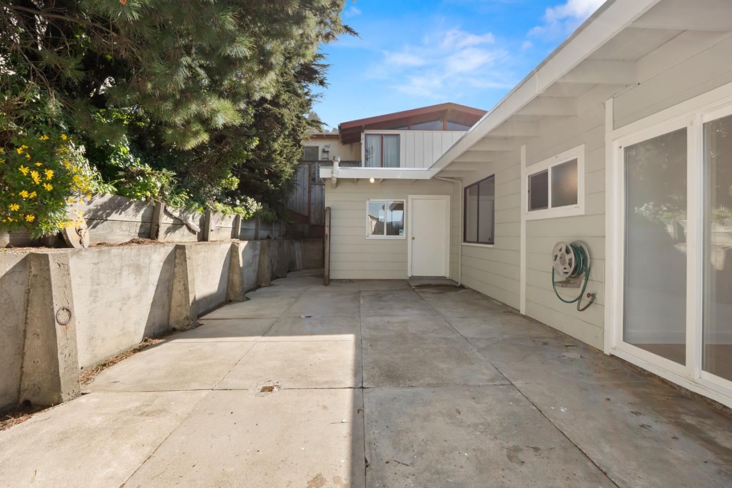 443 Monterey Road Pacifica, CA 94044 - Photo 22 of 26 a view of a house with a backyard
