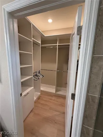 a view of closet area with empty racks