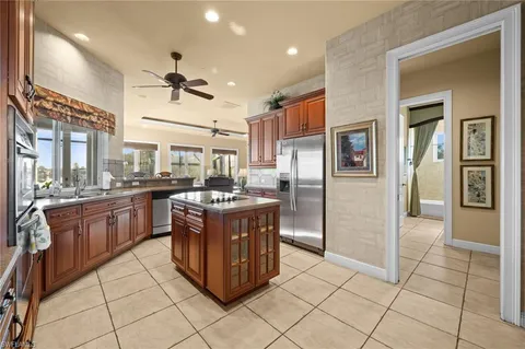 a kitchen with stainless steel appliances granite countertop a stove and a refrigerator