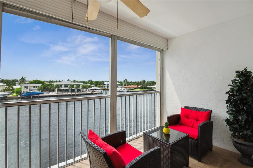 303 North Riverside Drive, Unit 403 Pompano Beach, FL 33062 - Photo 15 of 31 a view of a balcony with chairs