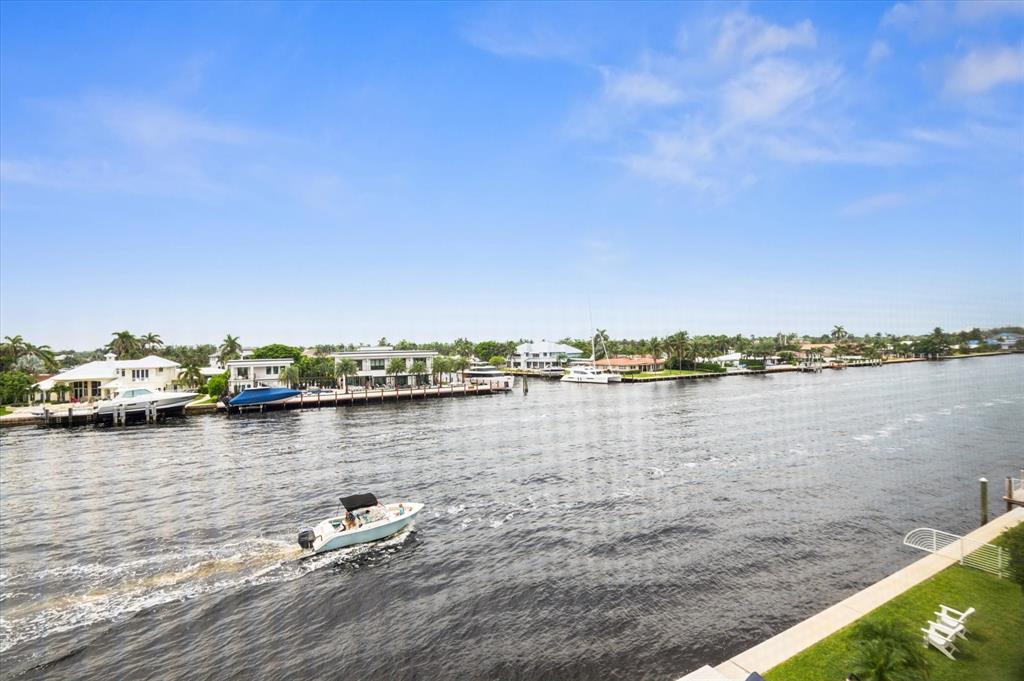 303 North Riverside Drive, Unit 403 Pompano Beach, FL 33062 - Photo 16 of 31 a view of a lake with houses