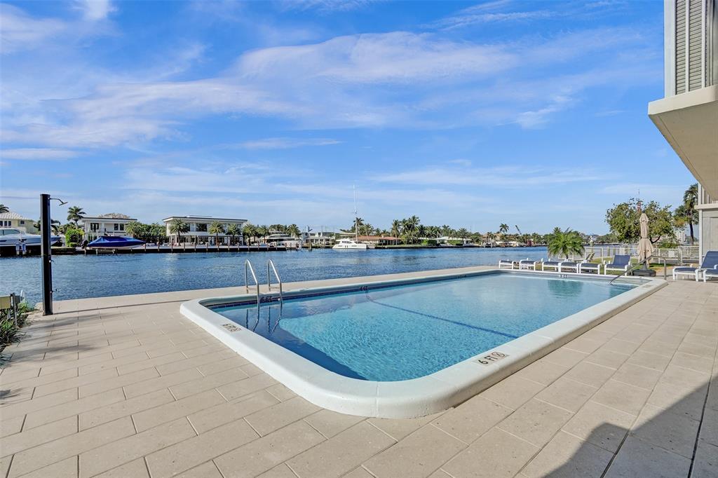 303 North Riverside Drive, Unit 403 Pompano Beach, FL 33062 - Photo 20 of 31 a view of a swimming pool with a terrace