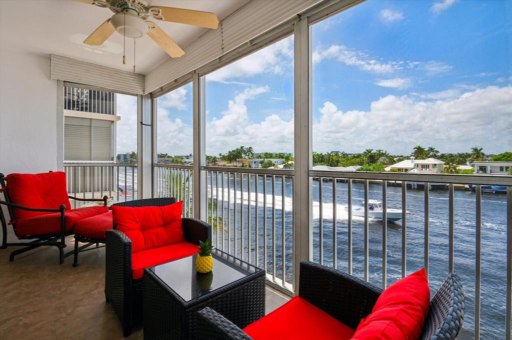 303 North Riverside Drive, Unit 403 Pompano Beach, FL 33062 - Photo 5 of 31 a living room with furniture city view and wooden floor