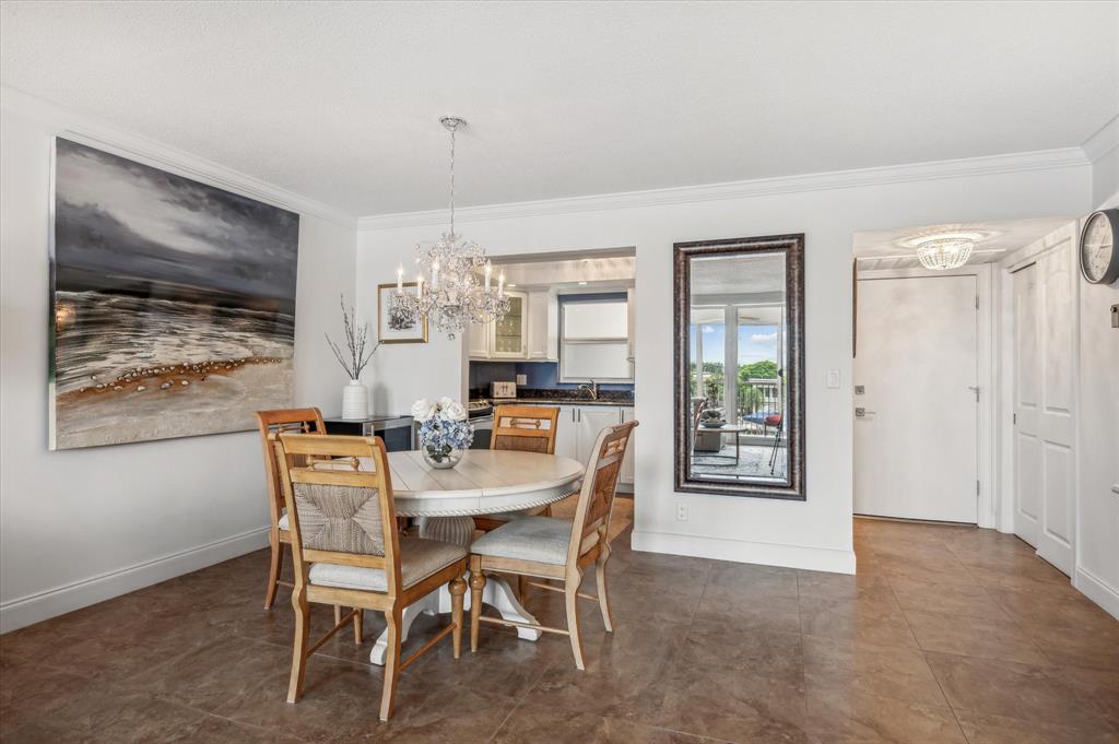 303 North Riverside Drive, Unit 403 Pompano Beach, FL 33062 - Photo 7 of 31 a view of a dining room with furniture window and wooden floor