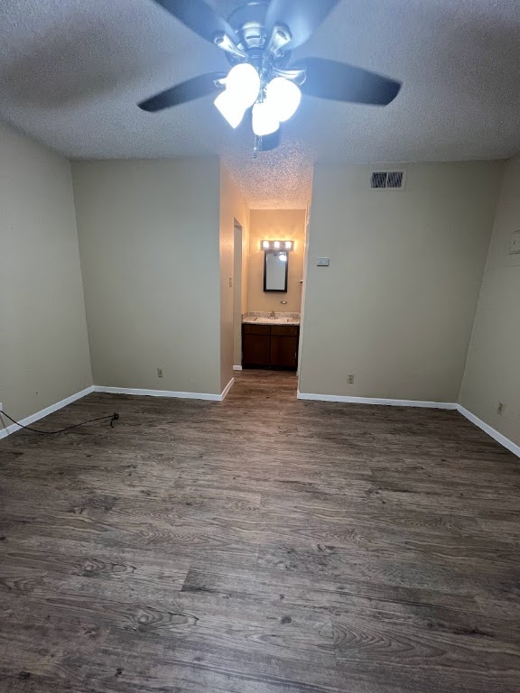 202 East 32nd Street, Unit 2 Austin, TX 78705 - Photo 13 of 22 a view of an empty room with window and wooden floor