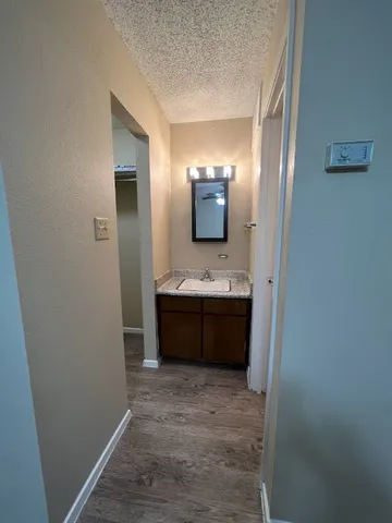 a bathroom with a double vanity sink and mirror