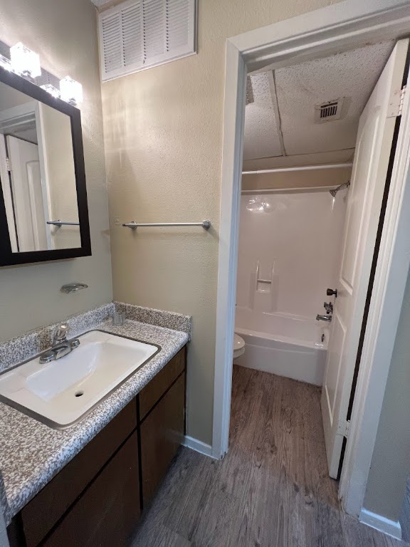 202 East 32nd Street, Unit 2 Austin, TX 78705 - Photo 19 of 22 a bathroom with a sink a mirror and a shower
