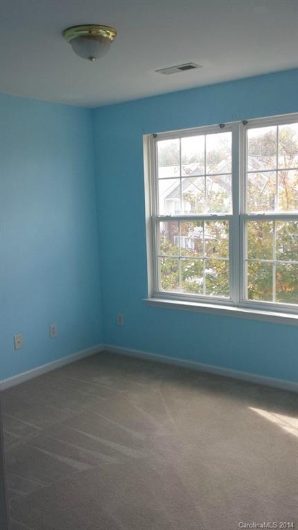 725 Shellstone Place, Unit 55 Fort Mill, SC 29708 - Photo 6 of 7 an empty room with a window