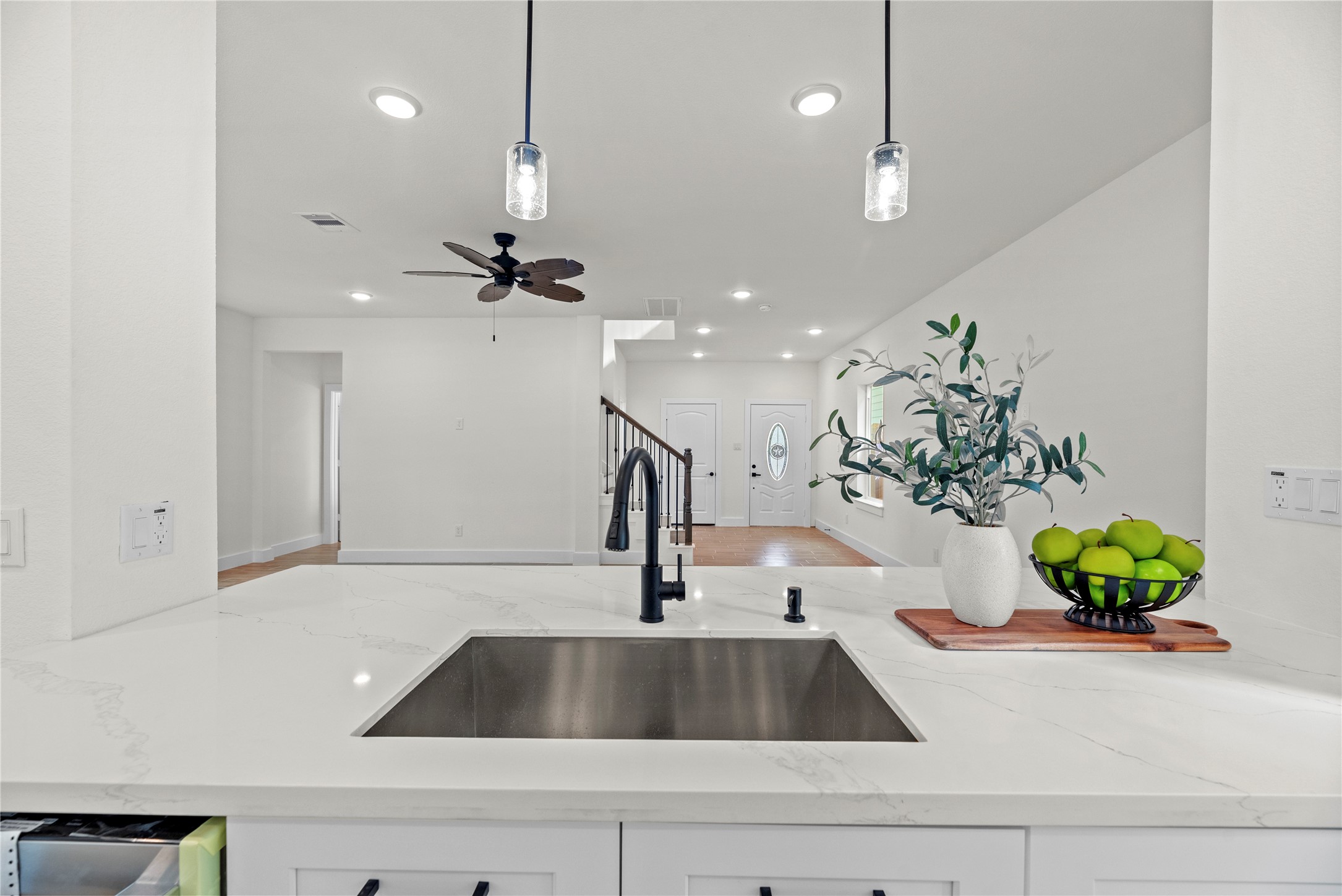 769 Marjorie Street Houston, TX 77088 - Photo 14 of 48 a kitchen with a sink hallway and chandelier