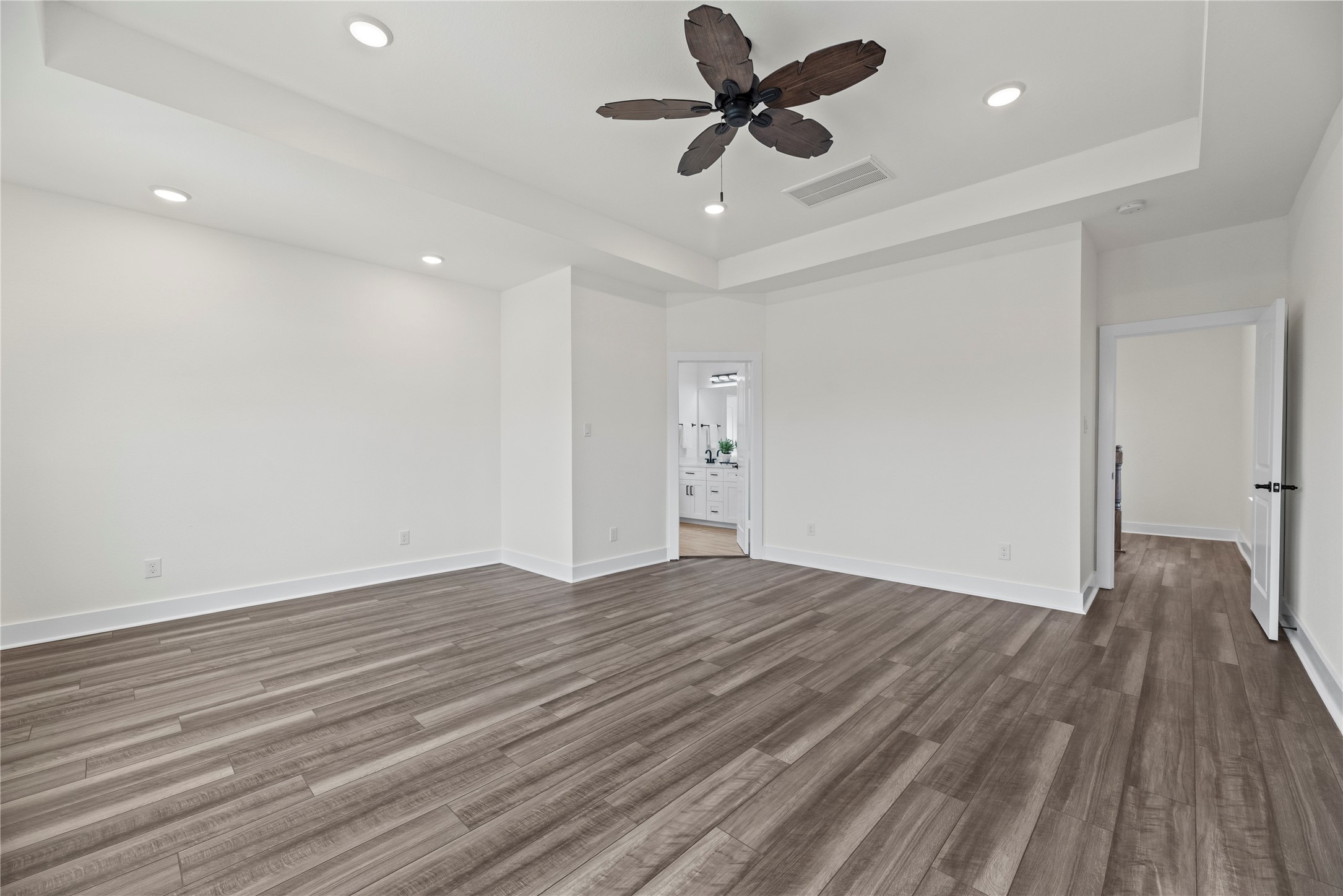 769 Marjorie Street Houston, TX 77088 - Photo 19 of 48 a view of empty room with wooden floor and fan