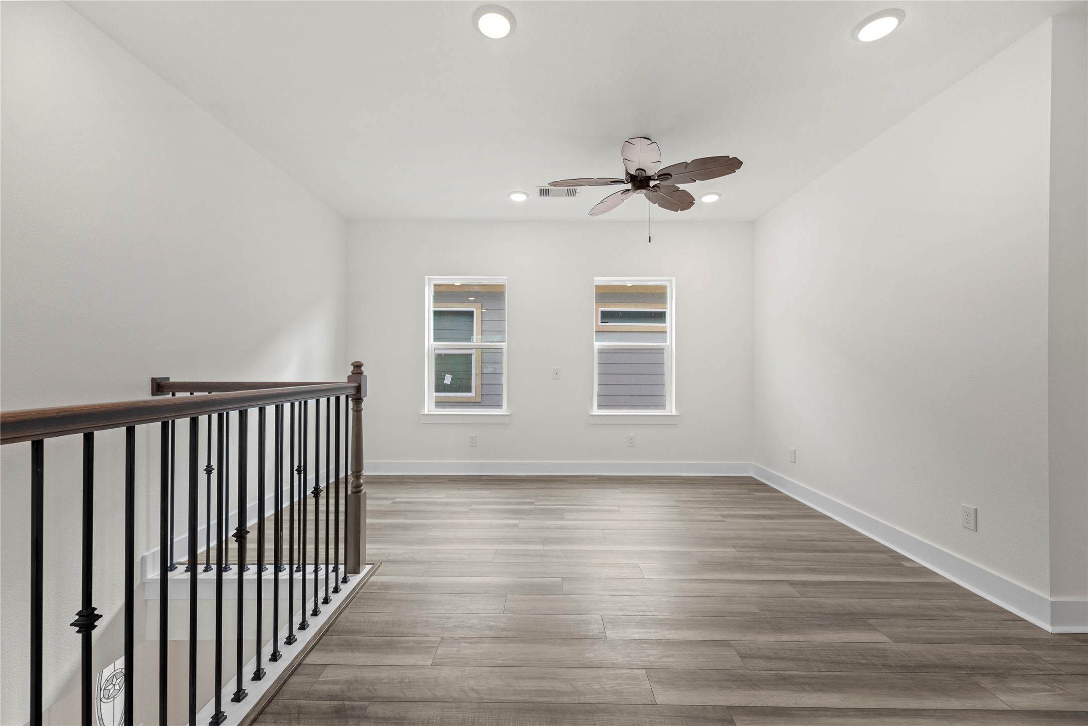 769 Marjorie Street Houston, TX 77088 - Photo 28 of 48 a view of a room with wooden floor and fan