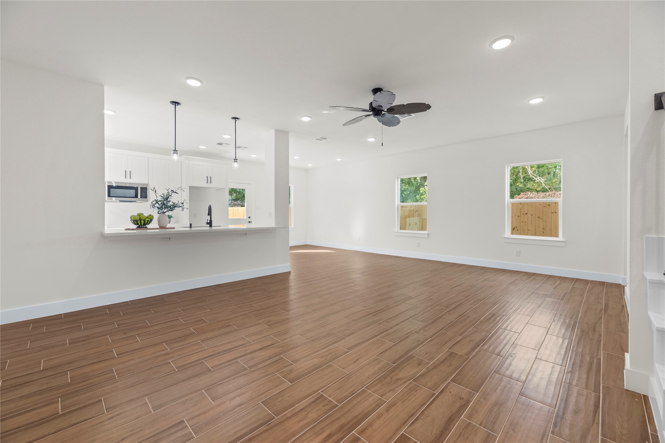 769 Marjorie Street Houston, TX 77088 - Photo 3 of 48 a view of an empty room with wooden floor and a window