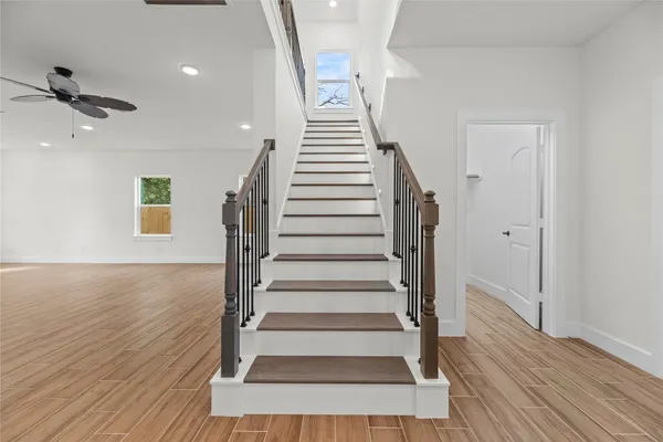 a view of a room with wooden floor