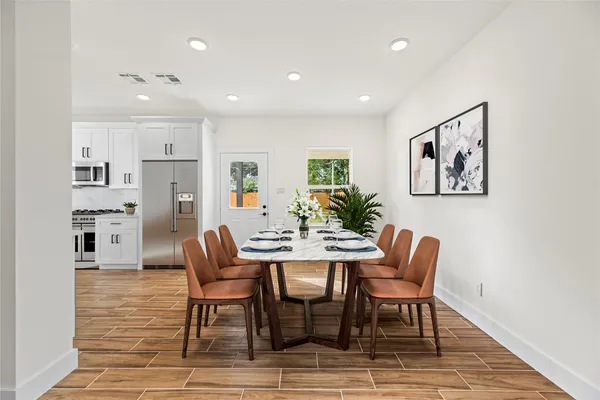 a dining room with furniture and window
