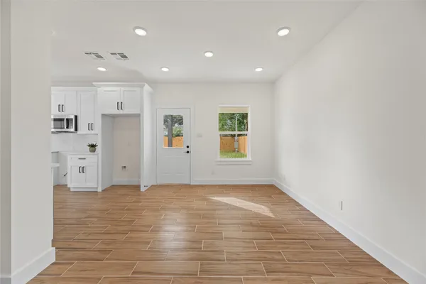 a view of an empty room with a window