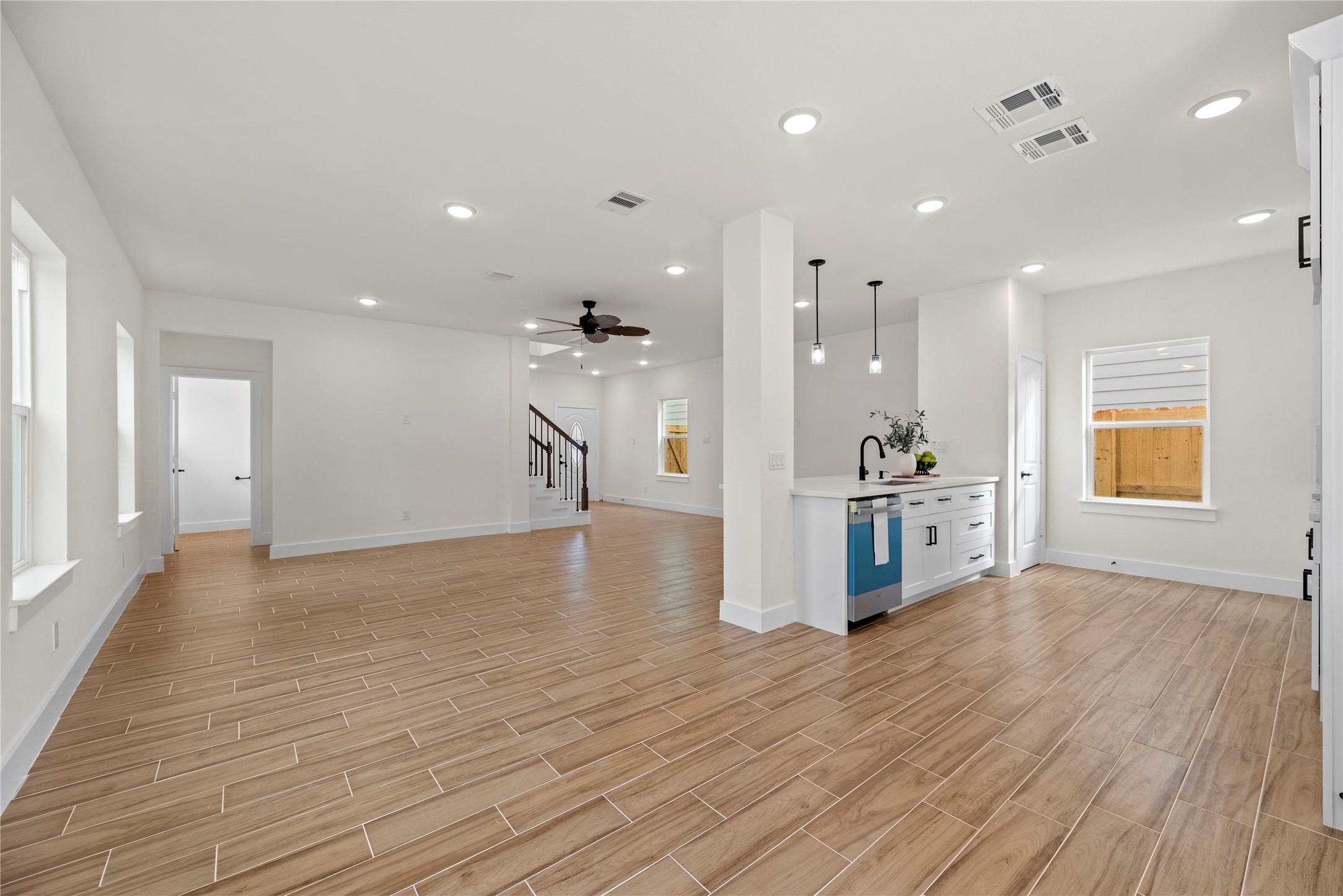 769 Marjorie Street Houston, TX 77088 - Photo 9 of 48 a view of a kitchen with refrigerator and wooden floor