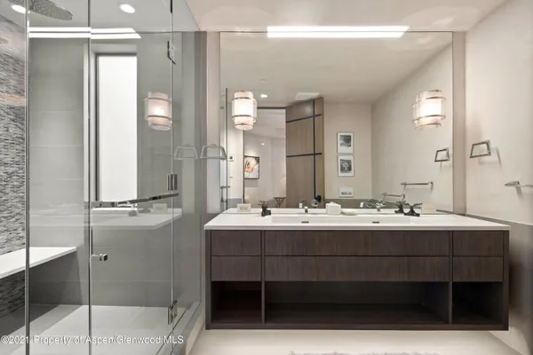a bathroom with a double vanity sink mirror and double