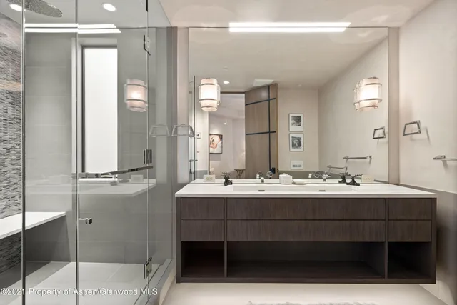 a bathroom with a double vanity sink mirror and double