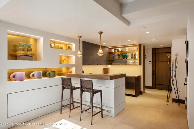 a kitchen with a table and chairs in it