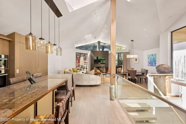 a view of a living room and dining room