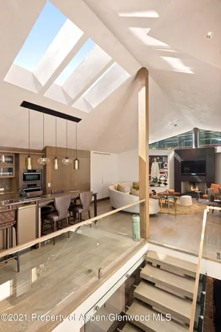 a view of a living room and kitchen