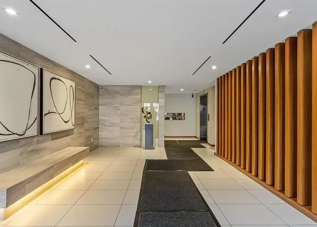 a view of a hallway with stairs