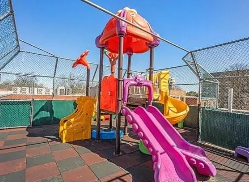 a view of a park with a slide