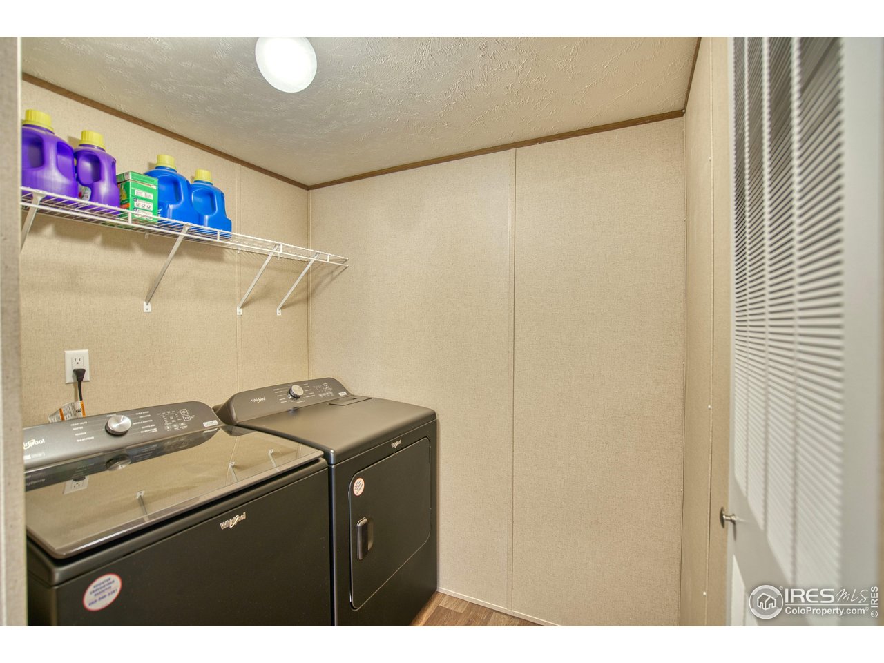 218 Grape Street, Unit 28 Hudson, CO 80642 - Photo 5 of 17 a utility room with dryer and washer