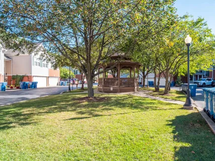a swimming pool with outdoor seating and yard