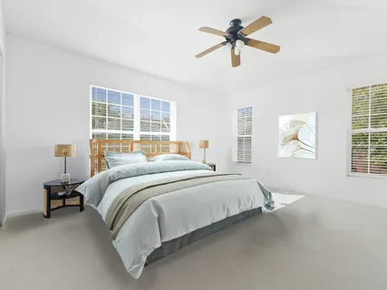 a bedroom with a bed and window