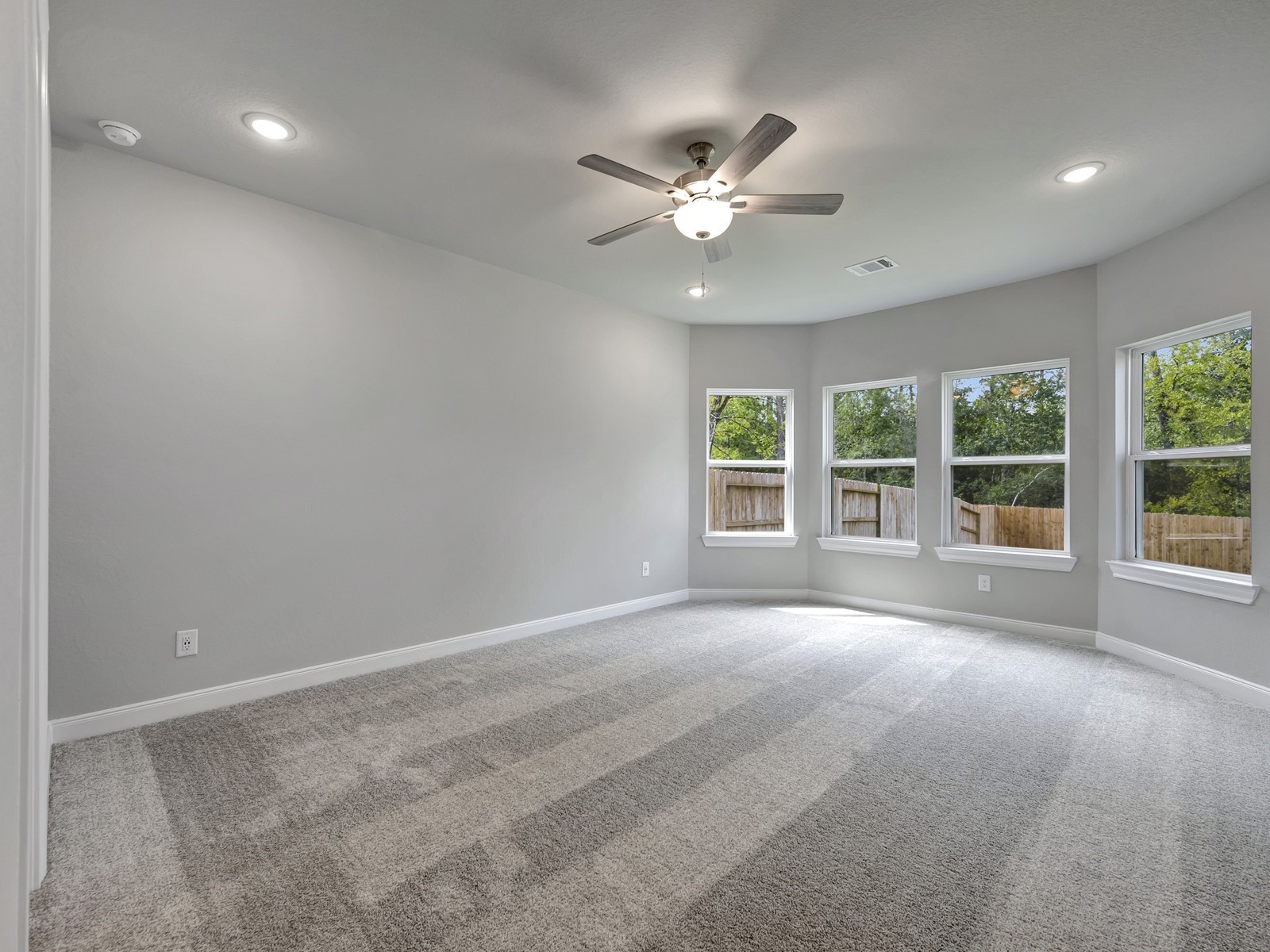 1645 Hopson Ranch Drive Conroe, TX 77301 - Photo 13 of 33 a view of an empty room with a window