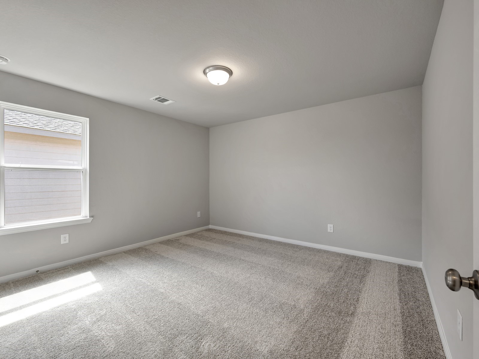 1645 Hopson Ranch Drive Conroe, TX 77301 - Photo 25 of 33 an empty room with a window