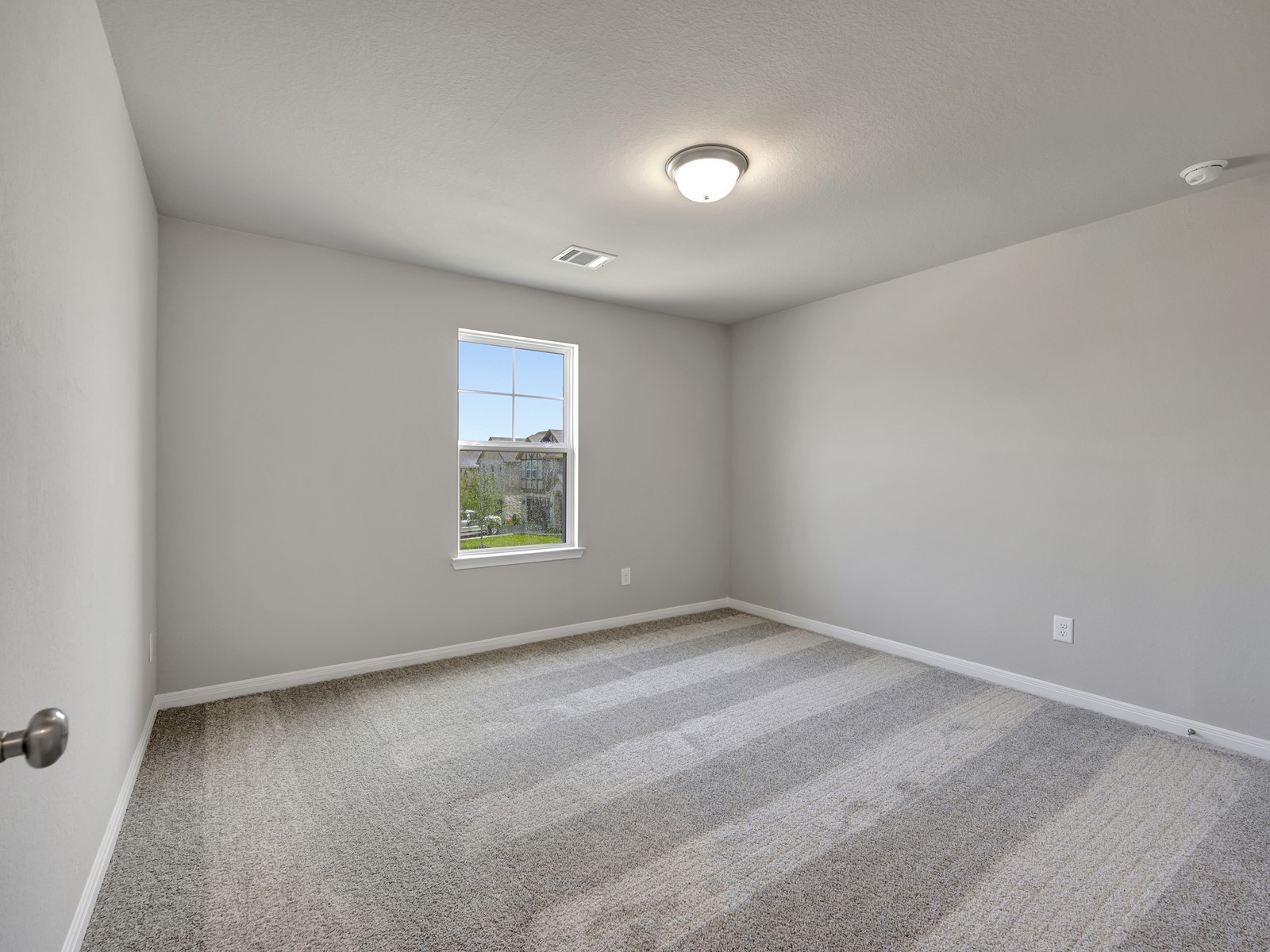1645 Hopson Ranch Drive Conroe, TX 77301 - Photo 27 of 33 a view of an empty room with a window