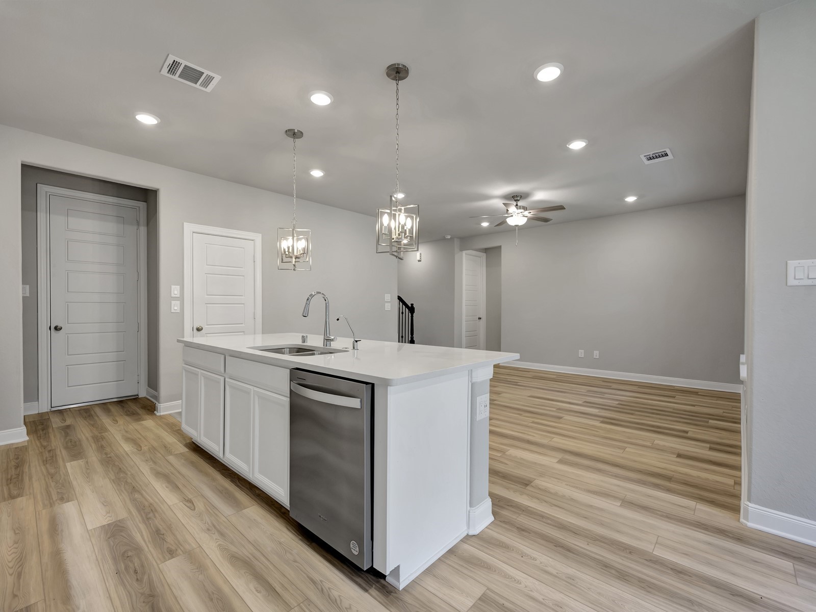 1645 Hopson Ranch Drive Conroe, TX 77301 - Photo 4 of 33 a kitchen with kitchen island a sink stainless steel appliances and cabinets