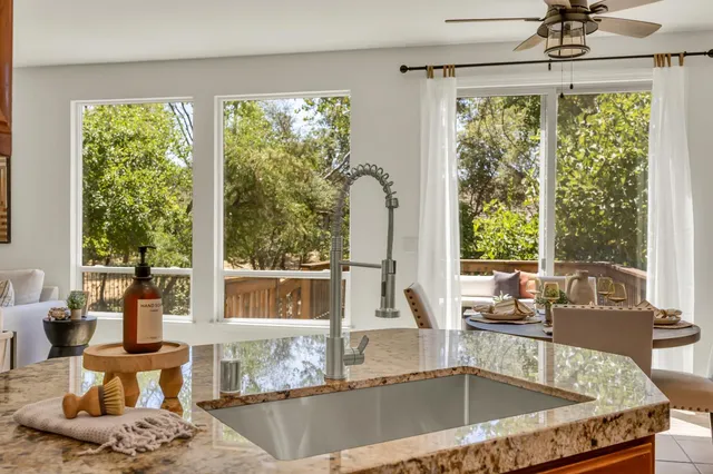 a vase of flowers sitting next to a window