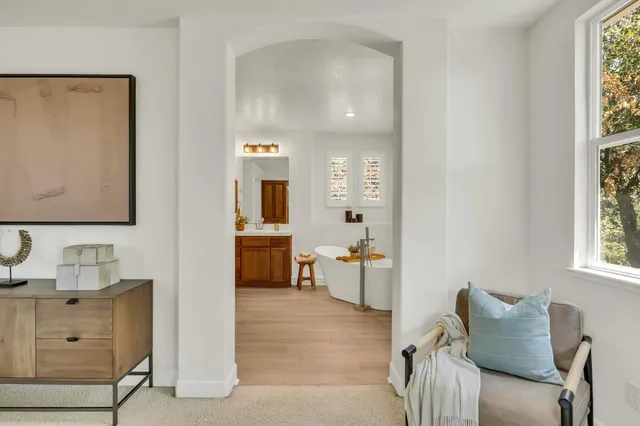 an empty room with windows and closet