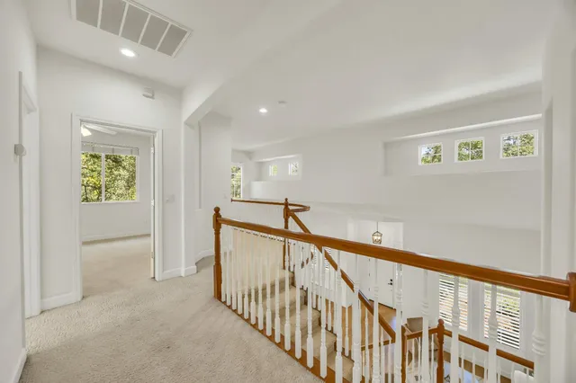 an aerial view of residential houses with city view