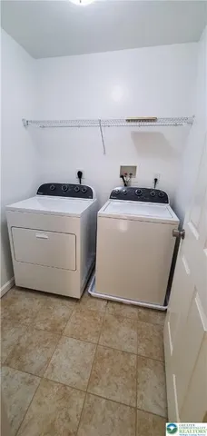 a utility room with washer and dryer