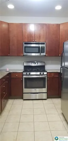 a kitchen with a stove and a cabinets