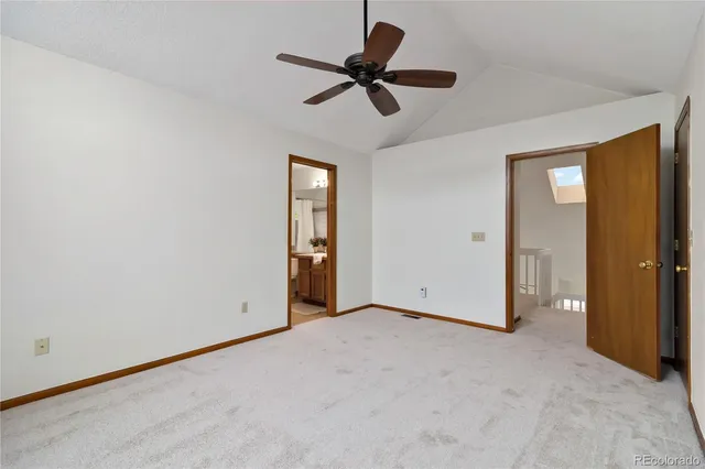 a view of empty room with a ceiling fan